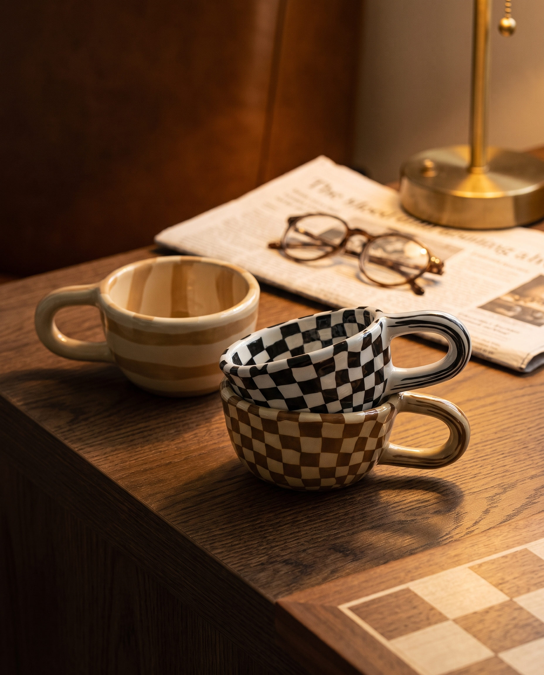 Checkered pattern cup on a dark oak side table in a quiet reading corner
