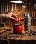 Enamel camp cup on a workbench