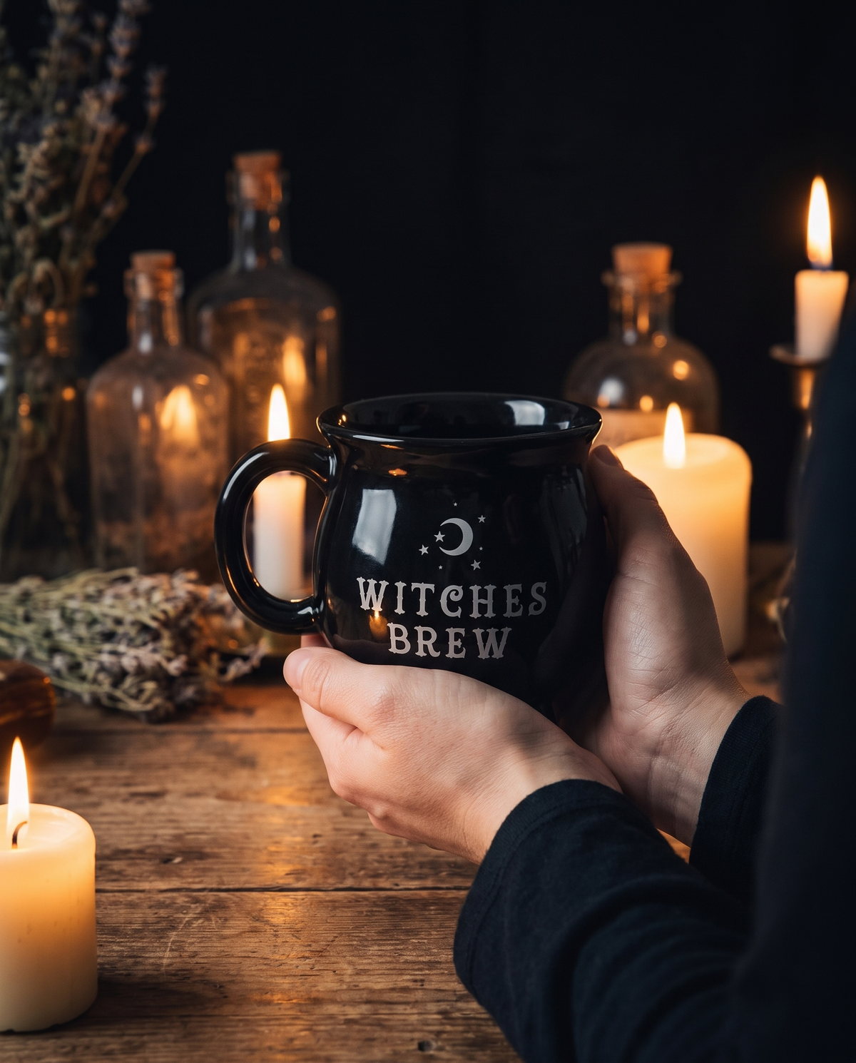Witch brew mug cradled in both hands