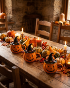 Three pumpkin mugs along a harvest table