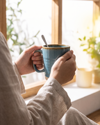 Retro glaze mug held by a window